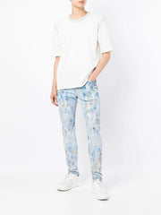 paint-splattered slim jeans