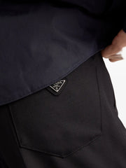 triangle-logo wool trousers