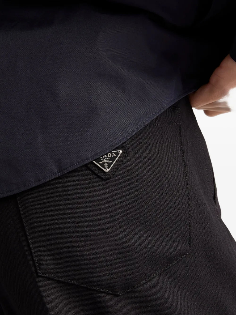 triangle-logo wool trousers