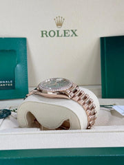 Rolex | Day-Date | 128345RBR | Rose gold | 36 x 43 mm | Rose gold | Green | Automatic