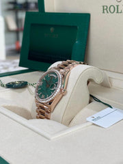 Rolex | Day-Date | 128345RBR | Rose gold | 36 x 43 mm | Rose gold | Green | Automatic