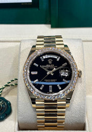 Rolex | Day-Date | 228348RBR | Yellow gold | 40 mm | Yellow gold | Black | Automatic
