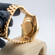 Rolex | Day-Date | 228238 | Yellow gold | 40 mm | Yellow gold | Green | Automatic