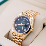 Rolex | Day-Date | 228238 | Yellow gold | 40 mm | Yellow gold | Green | Automatic