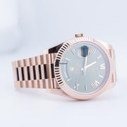 Rolex | Day-Date | 228235 | Red gold | 40 mm | Rose gold | Green | Automatic