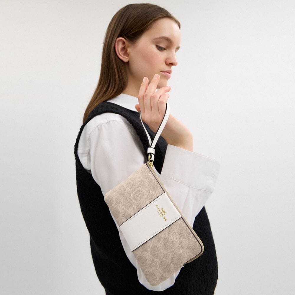 Coach Corner Zip Wristlet In Signature Canvas With Stripe Gold Sand Chalk
