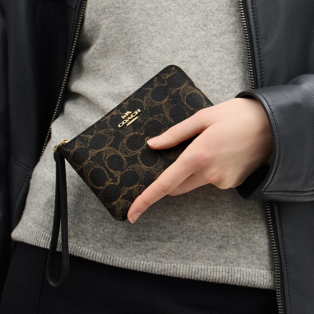Coach Corner Zip Wristlet In Loved Signature Canvas Gold Brown