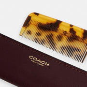 Coach Comb With Sleeve Brass Merlot
