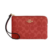 Coach Corner Zip Wristlet In Signature Canvas in Gold Crimson