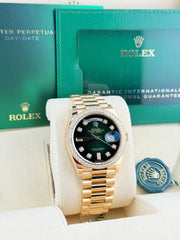 Rolex | Day-Date | 128348RBR | Yellow gold | 36 x 43 mm | Yellow gold | Green | Automatic